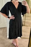 This dress, in a small, fits perfectly and is a quality fabric. It is a bit conservative feeling but the deeper décolletage helps to keep it from feeling too stodgy and will be perfect for work events. It's very comfortable and I know I will get many wears out of it! - Christina H.