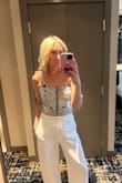 I got endless compliments on this top!! I wore my usual size but will say it runs slightly small, so if you're in between sizes I would go up one. Seriously so cute and goes with everything! - Catherine B.