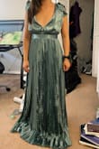 Beautiful fabric and "X" back. Love the pleats- very stylish and elegant but I am so DISAPPOINTED! The length is way too long and the bust is too large. I was hoping that this dress would fit and I knew from the reviews that it runs long, however, I did not realize just how long it truly would be. I am 5' 3" on a good day, and the longest part of the dress was 12" too long. The shortest part of the dress was 8" too long. The bust was unfortunately a BUST since it was meant for someone way more endowed than I ever will be. The waist was tight on me, and it didn't want to zip up fully, but I did manage... eventually. A good tailor could make the fixes I would need, however, I do not have the time nor money to do this before the wedding I am about to be a part of. I will be RETURNING, sadly. If you can sew difficult fabrics that are uneven, then you may take on this challenge. The pleats just make it hard. Just beware of the length and if you do not have a large chest, this dress probably is not for you. - Lia S.
