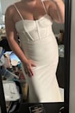 The pictures don't do it justice but it's very flattering and has a nice stretch to it. It has a bit of a train and some weight to it but it's perfect for a rehearsal dinner! I love that the straps are adjustable. - Katie W.