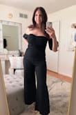 I love this jumpsuit! I wore it to a rehearsal dinner. I really love that the sleeves are separate from the top so that you don't have to worry about them sliding up. The top and sleeves stay in place! I sized up one to medium. - Debbie G.