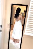 I have never considered myself fat until trying to fit in this dress. I couldn't even zip the lower part of it! As a 125lbs person at 5'6, I'll have to return and get a size L! That's ridiculous. - Lynn L.