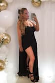 I wore this without a bra. It was tight enough at the top that my boobs stayed in place. It's REALLY LONG & I didn't have time to get it hemmed so I had to hold it up when I walked, even with 3.5 inch heels. I wore a velvet wrap with it, too and it complemented it well. - Jessica T.