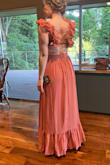 The material feels nice and heavy so it hangs nicely but breathes well. The color is fabulous. The detail on the shoulders is fabulous and not even very wrinkled at all! Hoping to not have to iron it before the wedding after traveling with it in my suitcase. Will probably just hang it in the bathroom while I shower to smooth it out. The length is a tad long but perfect with heels on! I'm relatively tall so might be too long on some - Natalie P.