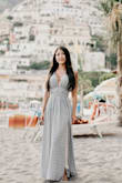I love the criss cross back of this dress! It's super playful and fun! I brought this dress with me on my trip to Italy and it was the perfect dress for my vacation! The material is light and flowy and the dress is flattering! - Jennifer D.