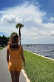 Cute romper! I got it in both black and orange. I usually wear a Medium but sized up and I'm glad I did - Angela R.
