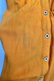 This dress has a very pretty rich mustard color, but even with a gentle wash and hang dry, it starts turning green in patches throughout the dress. I've tried using stain remover I've used in the past and works very well and it did nothing to remove the green color, meaning it's not a stain, but the actual color of the dress is changing. I only was able to wear this dress a half dozen times and now will not be able to wear it moving forward as the green patches are very noticeable. - Eleanor W.