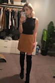 I love the block heel on the boots - much more comfortable to walk in then the skinny heel. These boots fall only slightly when I walk but never fall below the knee. I sized up only a half size and wore without socks (which led to blisters) so one full size up may be better if you want to wear socks with these! - Amanda B.
