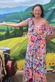 I selected this print because the theme of the botanic garden gala was sunflower Serata (Italy). The yellow flowers in the print were a close resemblance. Very comfortable and it fit me tight enough that no bra was necessary. I wore flats because it was not a formal event so the back hem dragged a bit. A small heel makes it the length perfect for me. - Mary A.