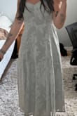 I love this dress. It looks exactly as it does in the photo, color especially! It was a little loose up top for me, but someone with a little more going on up there definitely would not have an issue! Very happy with my purchase - Cassandra H.
