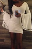 Fits well and true to size. The shoulders are on the wider side (more open) almost off the shoulders. If you have long arms the sleeves may be too short as the sleeves were exactly at my wrist and we're a tid but tight at the elbows. Love dress, I would recommend. - Rena W.