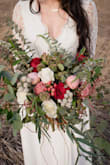 This dress is stunning! I am a photographer and purchased this dress for a styled session and the model totally rocked it. The scalloped lace detailing on the back is to die for, the material is high quality, and the neckline is very flattering. When I was planning this styled bridal session I knew what kind of dress I wanted. I looked literally everywhere for what I wanted but no luck, and when I found this dress it exceeded every expectation! This dress would be gorgeous for a wedding and it would look like it cost you an arm and a leg! - Bailee W.