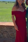 I love this dress so much that I have a black and a reddish one. The material has very little stretch so the breasts stay in place with and without body tape. The material is heavy enough that body imperfections don't show, but can definitely be wore in all seasons. I love the drop sleeve style because it gives the strapless illusion without showing the saggy skin under the arms. This was a big plus for me!!! You can totally dress it up with jewelry and look incredibly elegant or dress it down with a flowery shawl for an outdoor summer event. Very versatile!!!
I wore the red one for my son's summer outdoor wedding, but because I was "The groom's mom" I had the side slit altered to show less legs.
I am wearing the black one for an event this winter and will leave the side slit as is,
If you have a few extra pounds, this dress will elongate your figure and make you look thinner.
I totally recommend this gown. - Monica L.