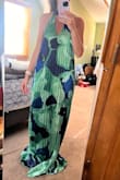 The dress is beautiful only thing is it's very long and I am tall even with heels dress still drags on the floor also the back fall a little higher than it looks on the model - Jennifer B.