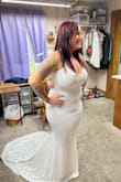 I had been looking for a few months for my wedding dress. I tried on 3 others from this website and this was the most amazing dress for our beach wedding! It is lightweight and so comfortable! The dress has stretch to it and fit perfectly! 2 of the others were a heavier material and would have been nice if it wasn't for the beach/hot weather. I did have it hemmed in the front because I am short and not wearing heels, otherwise the length would have been good. I cant wait to wear it to the wedding! I read so many reviews trying to find a dress and they helped me so much so I hope this helps you too! Buying a wedding dress online was stressful but if you are on the fence about buying this dress for a beach wedding, BUY IT, you wont regret it! - Jacelyn W.
