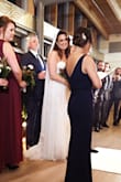 I bought this dress for a winter wedding and received lots of compliments. The dress is very simple, so I added a thin, sparkly black belt to give it a little more interest. Overall, the dress is really comfortable and has a great weight to it (i.e. it doesn't feel cheap). Some notes:  I'm rather petite so I had to get the straps shortened (they kept calling off my shoulders), and even after shortening the straps, there was still a LOT of cleavage because the v-neck drops pretty low...something to keep in mind if you're considering this for a more conservative event. And I wore 4.5" heels but had to get the dress hemmed... but I have to get everything hemmed because I'm so short! - Jess T.