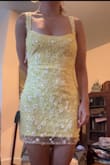 Definitely super cute but you can tell it's cheaply made. About a dozen sequins had fallen off between opening it and actually trying it on and the fabric of the lining just feels cheap. Same feel as the strings it's laced up with in the back. Definitely a bit short too. I'm between xs and s but went up to the small and so glad I did or I would be flashing everyone. I really like it but definitely don't think it's worth the price especially if you want to wear this to an event (this is just for my birthday so I'm not super picky about it) - Morgan S.