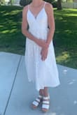 The dress wasn't as sparkly in person as it was in the photos. It personally isn't my style because I would want a skirt with more flow to it for dancing, but is still a great reception dress. I was hesitant that it wouldn't fit my small chest, but fits perfectly. - Addie B.