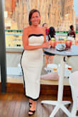 Got so many compliments! Dress is beautifully made has a great stretch to it. Rubs a little small so if you don't like that tight fit and like it a little on the loose size I would size up. - Sherrianne P.