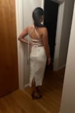 Bought this two piece for a night out, and I loved the way the back looked. The top is tied in a way that secures the girls, which I appreciate. The only thing I didn't love was the zipper in the back, it protrudes slightly... But overall great buy, can wear the pieces separately too and it can be dressed up or down. - Iona B.