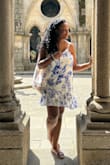 I love this dress! I bought it for my trip to Portugal and I must say it was perfect! It is not tight and definitely leaves some breathing room. I am wearing a size large. - Christine N.