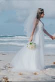 I love it! It was my favorite dress out of all I tried for my wedding. For me was a little tight but the next size was out stock, so I keep the 6 and it worked out great! A lot of compliments, looks really high end couture, nice details, and perfection. Thank you! - Mabel A.