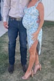 Beautiful dress! Material is great and stretchy for expecting mamas! Sized up to a medium to fit my growing bump! The material is very forgiving allowing it to be a maternity dress also! - Alex W.