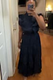 This dress fit me so well. I can wear a small and medium in a lot of things but I'm glad I ordered a small. My midsection requires a tighter fit and this did it. The fabric is nice and soft. The ruffles added a touch of elegance and turned a plain dress into something interesting. - Martha B.
