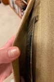 Cheaply made, beading easy to snag on clothing/couches so beware. It also barely fits a phone. I had cut the tag off before coming to the realization I dont care for it and now cannot return. - Jade G.