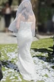 I wore this for my wedding. It was beautiful! I had to get the length shortened but other then that it was perfect. I ended up leaving it on all night. It does not look cheap at all. High quality and very comfortable! I tried on a bunch of their dresses and even went to their store. This was the winner. - Christina S.