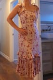 I took a chance on this dress as it has very mixed reviews on quality and fit, with many saying it ripped, snagged, or had issues with  zipper. I would agree that the fabiric is delicate and there is no stretch,  so ordering the right size is crucial. For me, it was a perfect fit with little wiggle room in the waist, but not in the bust. I also liked that the straps can be tightened to ones preferance and I even tied it as a halter by tucking in the back straps into my strapless bra. Overall, I love it and plan on wearing this for many ocassions. - Nan T.