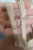 It looks cheaper in person than it does online. They also sewed the part that adjusts the straps on backward >#># not noticeable to the public eye but is awkward when you're adjusting it yourself. I still kept it and it looks really good on!! Just wasn't quite what I was expecting - Kelcie H.