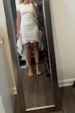 It's very cute on but the fabric definitely has no give, as another review said. I wish there was an in between size since the medium was swimming on me up top but was a little more comfortable. The small was more flattering but does lift a little high in the back (couldn't clasp it on my own). - Kristine T.