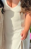 This dress was beautiful, loved the details on the back and the flutter sleeves. I have a large bust (34J) so it was a little tight/small. I did alter the slit a little so it was closed a bit more, but that was a $10 fix! - Gabriella S.