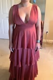 I bought this dress last minute for a formal outdoor wedding. I wanted something that would be easily accessible to nurse my baby in. Ribs down fit perfectly but it was gaping at the side boob so much that my BF boobs were spilling out. Now, if I had smaller perky girls, this dress would have been an A+

My mom is great at alterations so I tried having her fix the top section and with the way the dress was made, it's just impossible. This dress does not work with slim and big chested girls.


2 stars because the style is very cute - Natalie G.