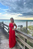 Wore this dress to take vacation pictures and I can't say enough good things.  Soft breathable fabric that still had structure.  May need to size up if you have a larger chest, but otherwise, I would say it was TTS and fit perfectly.  I am 5'5 and was able to comfortably wear flats and it did not drag the ground.  The color is a vibrant red and photographs very well.  10/10 would absolutely recommend. - Rachel M.