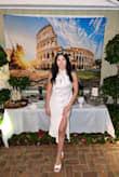 I absolutely fell in love with this dress the moment I tried it on. The open back, slit on the leg, and the tighter fit make this dress look absolutely amazing! I received so many compliments about this dress both at my bridal shower and on my honeymoon. I am finding any excuse to wear this dress again! - Alejandra S.