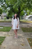 This dress is so cute and fun! The part that goes around my boobs does feel a little loose, but if I had done a size down I think it would have been a bit too tight. But I am very pleased with this purchase! I apologize that one of the photos is blurry! - Ann M.