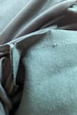 Purchased dress to wear to a wedding. Dress arrived on time. Tried on dress and it has a hole below the zipper. Looks like the stitching wasn't even completed. - Yolanda V.