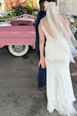 I absolutely loved this dress. I wore it for my wedding!! It has just the right amount of detail with the lace in the back and the buttons, but it was still very simple. It fit me perfectly, and it looked great in my photos. - Isabelle S.