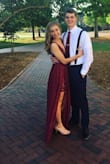 This dress is beautiful. I wore it to my college formal and got so many compliments! The lace part of the dress fits tight like a bodycon while the long skirt is flowy and beautiful. Highly reccomend! - Emma M.