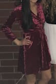I wanted to order a size x-small, but they were all out. Instead I ordered a small knowing I'd be able to wrap it and make it fit! This dress is perfect and has a very sophisticated look. The dress is a deeper wine red in person, but still looks great! Will definitely be making another purchase. - Maddie K.