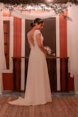 I bought this dress on clearance for my intimate wedding, and it was perfect! So elegant and it fits just right. I only had to hem it, but I also decided to take in some of the sleeve so it wouldn't flare out so much. - Michelle N.