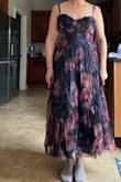 I'm 9 weeks postpartum and have a wedding to go to in a few weeks. Usually would wear a medium but sized up to a large since a lot of the other reviews said to size up, so I ordered a large. The large had a bit of extra room and I knew it was supposed to be a tight bust. There was quite a bit of flatness in the pleats from shipping. I decided to exchange this for a medium and see if that made the dress look better. The medium is the second picture, which fits much better but even more flatness in the pleats from shipping. I reached out to customer service to see how to get the pleats back to how they should be and was basically instructed how to repleat the entire dress from top to bottom. They offered me a refund for the dress which I took because I don't feel like for the price of the dress I should have to repleat the entire dress myself by the time I get it. Customer service was great. The dress just didn't work out for me - MEGAN W.