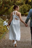 I'm a small-medium (small is a bit too tight, medium is a little loose) so I went with a medium and got creative with the back tie. It was SO comfy and flattering! Being able to hand-wash it was great too. Loved this dress, esp for this price! (Photo creds to Alex Wyly) - Jessica O.