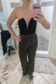 Fits like a glove. I think I'll wear some tape with it. It doesn't have a zipper, just stretches to get it on. I'm 5'2 and it fits me perfectly. I imagine if you were longer in the torso it wouldn't fit. - Stephanie M.