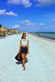 It fits just perfect. Looks great. It is definitely a little longer than I expected but thats fine.Perfect for the beach <3 - Amiksha G.