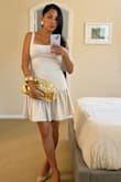 I recently added this beige cocktail dress to my wardrobe, and it has quickly become one of my go-to pieces for any elegant event. The subtle beige tone is incredibly versatile, making it easy to accessorize with statement jewelry or a bold clutch. The fit is flattering, hugging the body in all the right places without being too tight. The fabric has a slight sheen that adds a touch of glamour, perfect for evening occasions. Whether you're attending a wedding or a formal dinner, this dress strikes the perfect balance between sophistication and understated style. Highly recommend for anyone looking to elevate their cocktail dress collection. - Irina S.