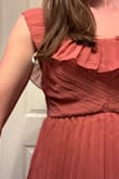 This dress is almost so beautiful and has a nice weight to it but the extra fabric that gathers on and under my bra looks horrible. I don't know what it's there for but I have to return the dress because it's just not wearable. It sits under where my boobs sit so I don't understand the purpose of it and it just looks saggy and gross. - Morgan A.