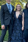 I wore this as a guest to a fall wedding and it was perfect! Hid my belly and very flattering. Got lots of compliments from other guests throughout the day. Super comfortable. I did use 2 sided sticky tape just to make sure no boob slips throughout the dancing portion of the evening, but there were no problems! - MacKenzie W.